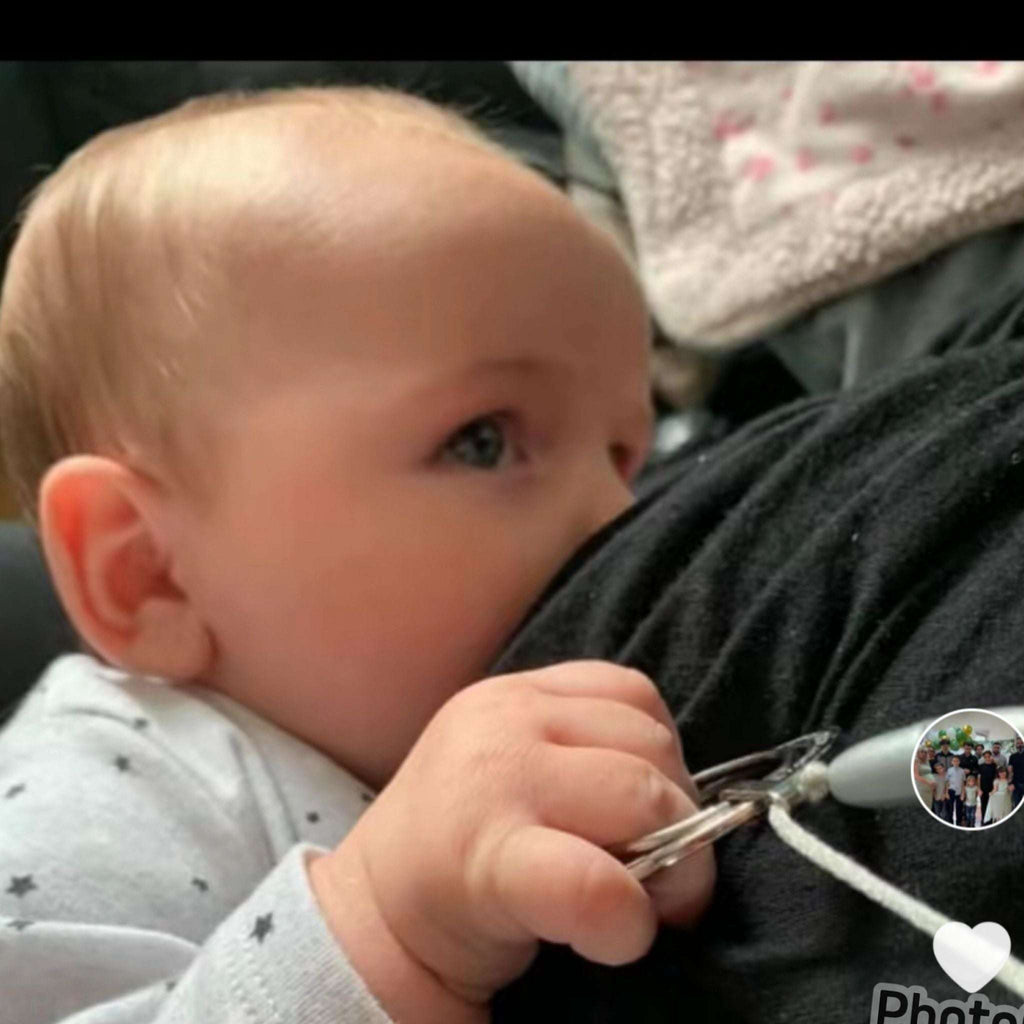 What Can I Give My Baby to Hold While Feeding?