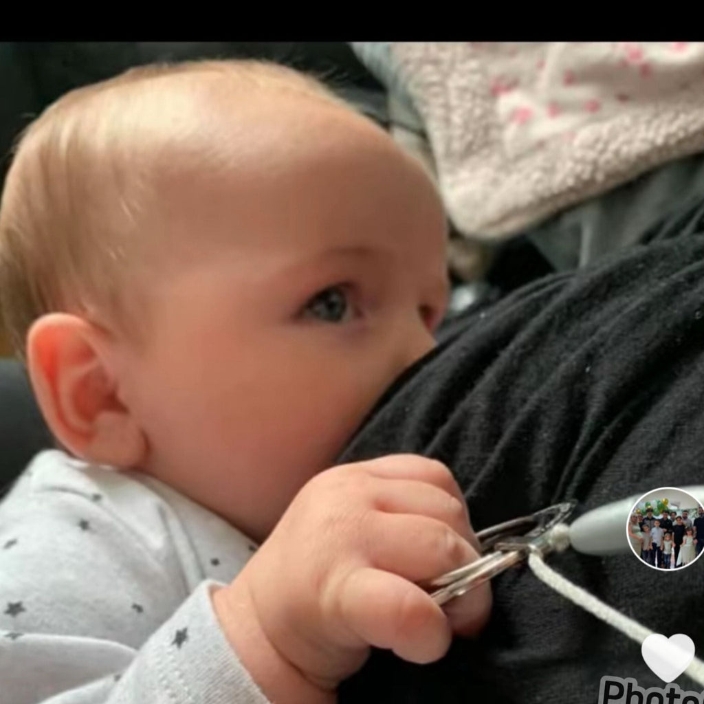 What Can I Give My Baby to Hold While Feeding?