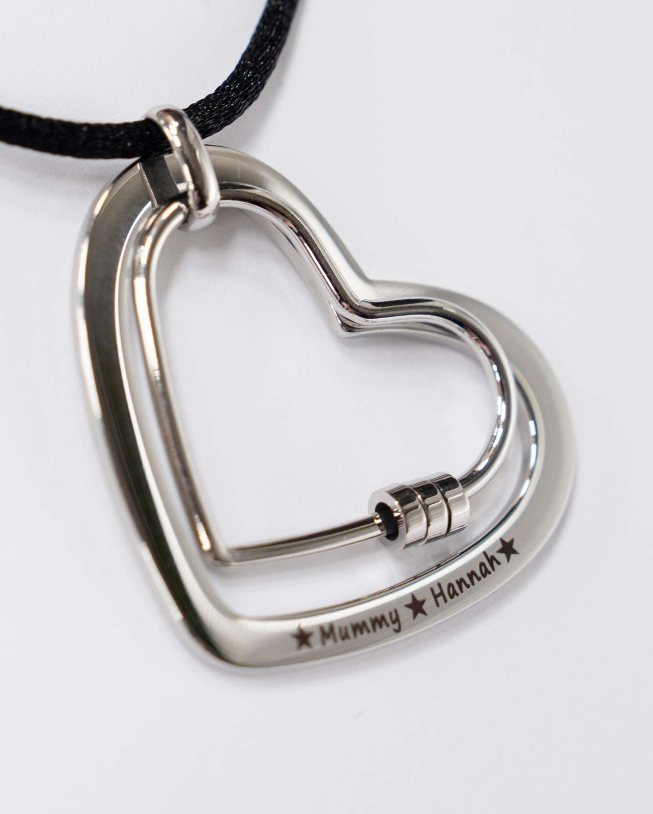 The Smooth Heart engraved stainless steel feeding necklace with smooth heart pendant on cotton cord for calming babies during feeding